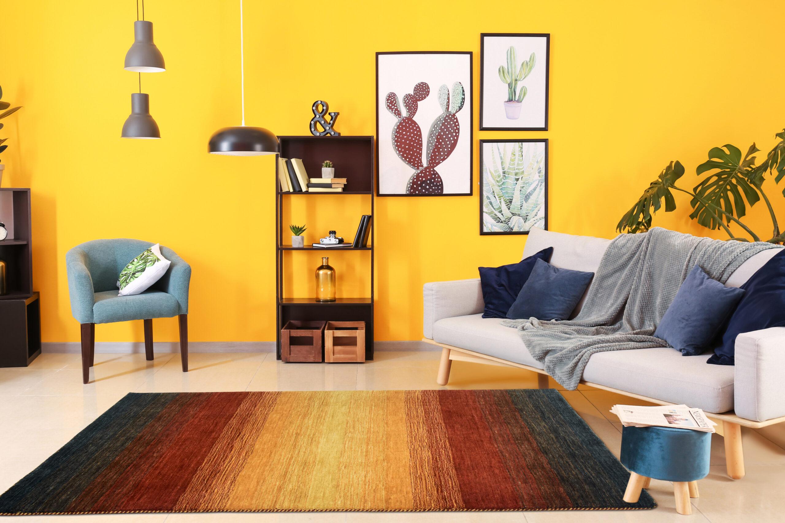 Stylish interior of living room near color wall